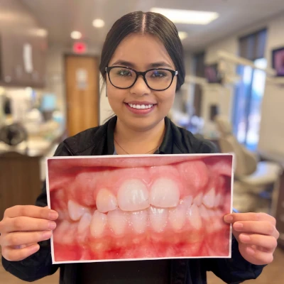 Holding Before and After Adult Braces Picture